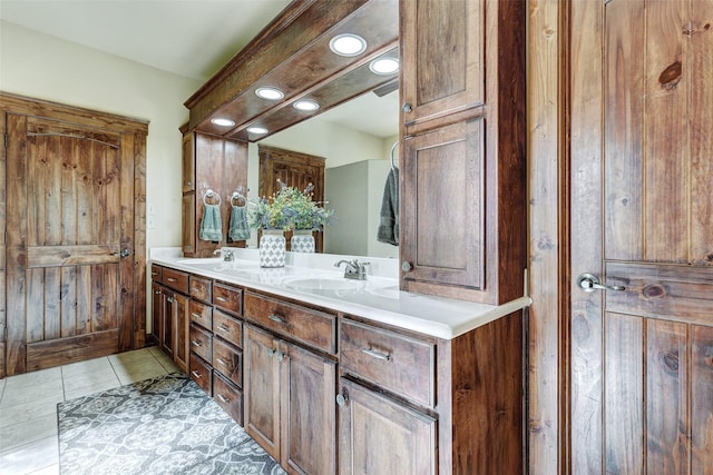 full bathroom with double vanity, tile patterned flooring, and recessed lighting