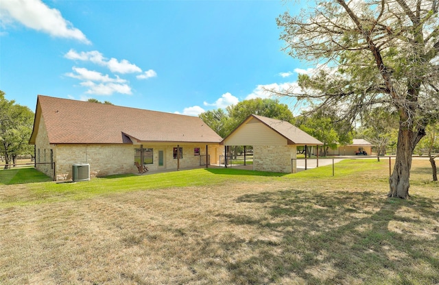 7265 Mcgregor Park Rd, Temple, TX 76502 - back of property with stone siding, a yard, and cooling unit
