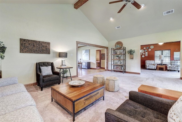 living area featuring high vaulted ceiling, light colored carpet, ceiling fan, beam ceiling, and baseboards