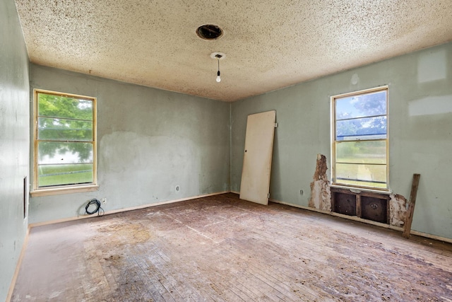 64 Pershing Dr Unit A & B, Denison, TX 75020 - unfurnished room with a textured ceiling