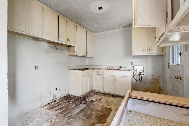 64 Pershing Dr Unit A & B, Denison, TX 75020 - kitchen with cream cabinetry and a sink