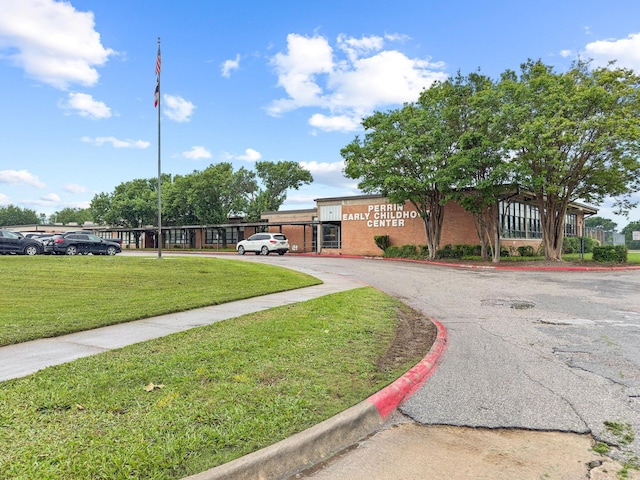 64 Pershing Dr Unit A & B, Denison, TX 75020 - view of front of house featuring a front yard, uncovered parking, and brick siding