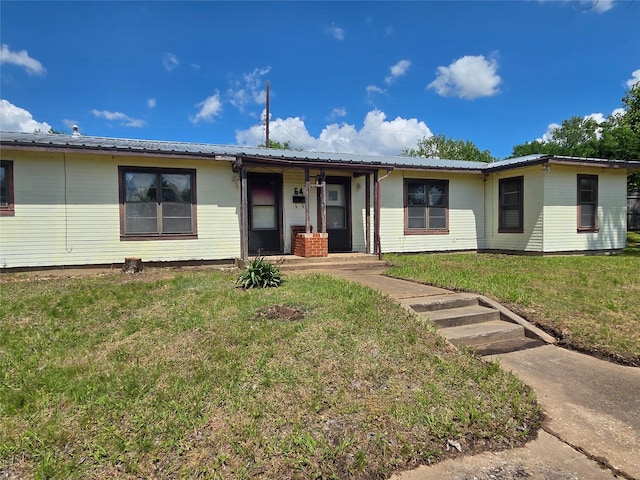 64 Pershing Dr Unit A & B, Denison, TX 75020 - ranch-style house with a front yard, metal roof, and a porch