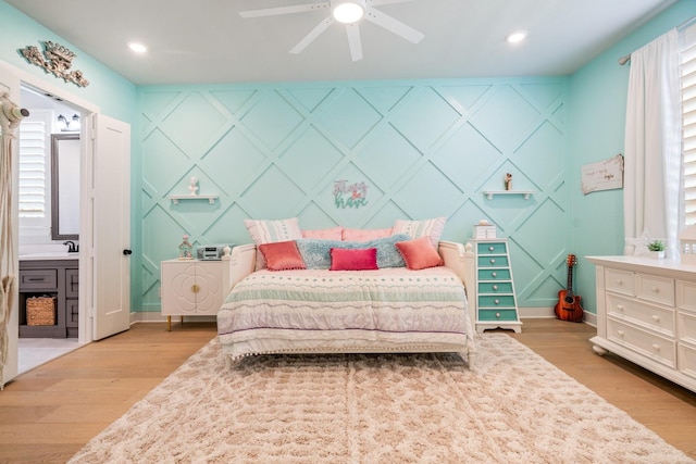2200 Sandalwood Dr, Prosper, TX 75078 - bedroom with a decorative wall, light wood-type flooring, baseboards, multiple windows, and recessed lighting