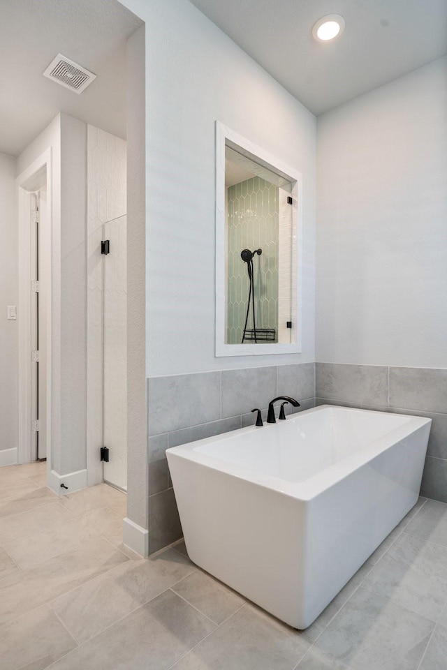 2200 Sandalwood Dr, Prosper, TX 75078 - full bathroom featuring tile walls, a soaking tub, and tile patterned floors
