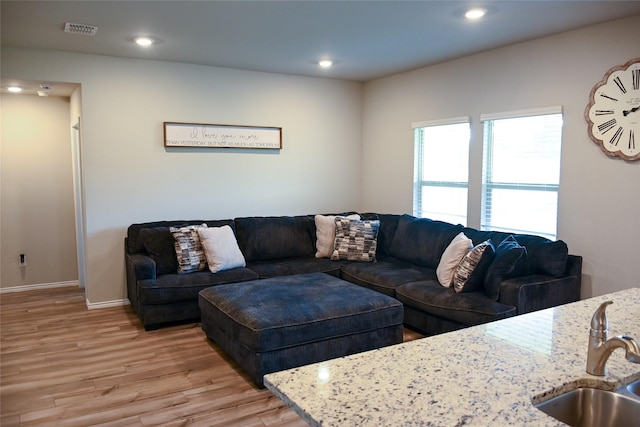 7121 Guadalupe Rd, Waco, TX 76633 - living room with light wood-style flooring, recessed lighting, and baseboards