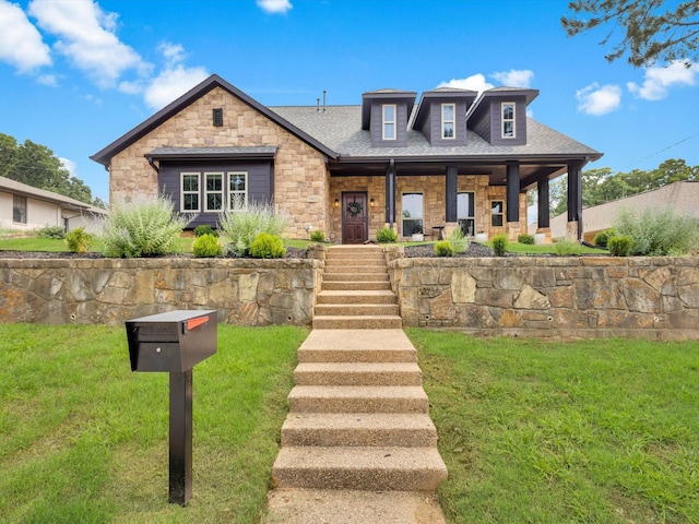 1806 Briarcrest Ln, Arlington, TX 76012 - view of front of house featuring stone siding, covered porch, a front lawn, and roof with shingles