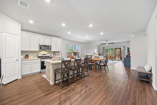 252 Rosewood Dr, Lavon, TX 75166 - kitchen featuring stainless steel appliances, a center island with sink, healthy amount of natural light, open floor plan, and recessed lighting