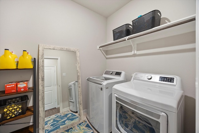 252 Rosewood Dr, Lavon, TX 75166 - clothes washing area featuring washer and clothes dryer and wood finished floors