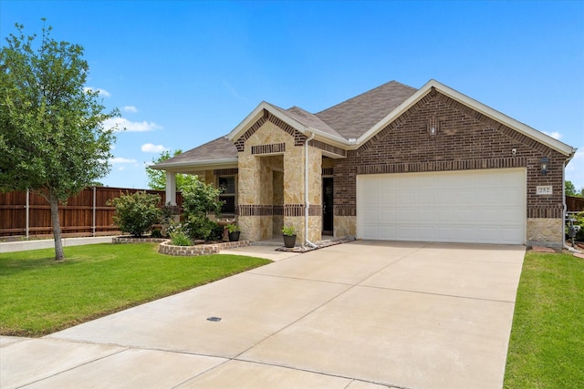 252 Rosewood Dr, Lavon, TX 75166 - view of front of house with stone siding, a shingled roof, an attached garage, and concrete driveway