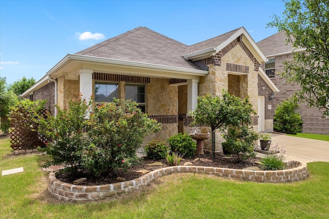 252 Rosewood Dr, Lavon, TX 75166 - view of front of home with stone siding, a front lawn, and driveway