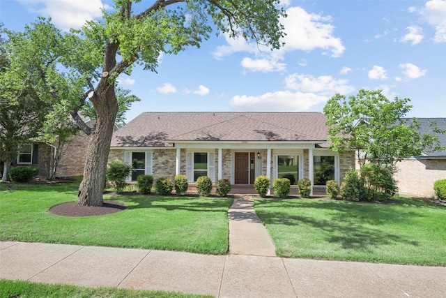 2848 Oxford Ln, Flower Mound, TX 75028 - view of front of home with a front lawn, brick siding, and a porch