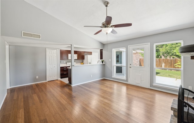 2848 Oxford Ln, Flower Mound, TX 75028 - unfurnished living room featuring hardwood / wood-style floors, a ceiling fan, baseboards, and high vaulted ceiling