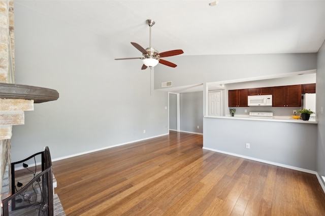 2848 Oxford Ln, Flower Mound, TX 75028 - unfurnished living room with ceiling fan, wood finished floors, baseboards, and high vaulted ceiling