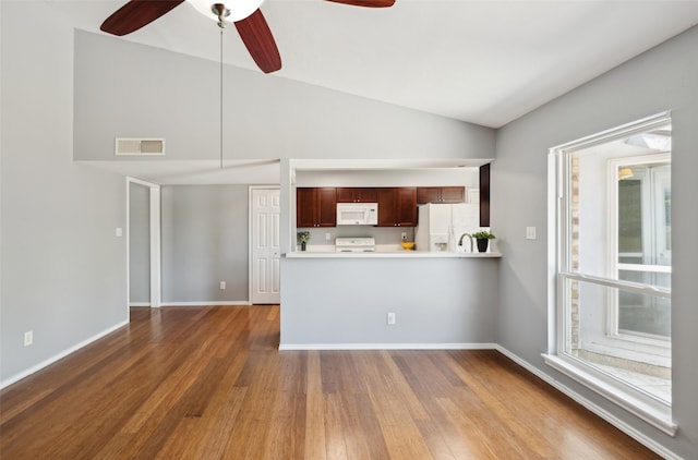 2848 Oxford Ln, Flower Mound, TX 75028 - kitchen featuring white appliances, dark wood-style floors, light countertops, ceiling fan, and baseboards