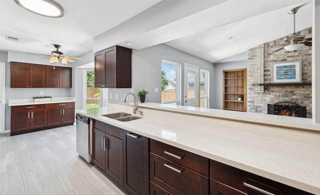 2848 Oxford Ln, Flower Mound, TX 75028 - kitchen featuring a sink, a ceiling fan, healthy amount of natural light, dishwasher, and vaulted ceiling