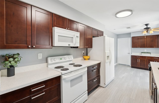 2848 Oxford Ln, Flower Mound, TX 75028 - kitchen featuring white appliances, a ceiling fan, and light stone countertops
