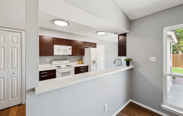 2848 Oxford Ln, Flower Mound, TX 75028 - kitchen featuring white appliances, dark wood finished floors, light countertops, and baseboards