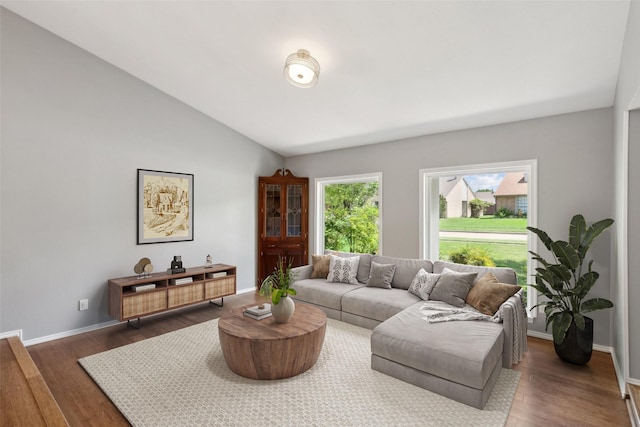 2848 Oxford Ln, Flower Mound, TX 75028 - living room featuring dark wood finished floors, baseboards, and vaulted ceiling