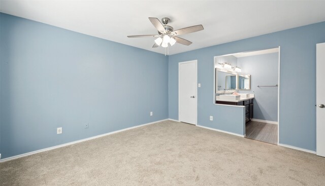 2848 Oxford Ln, Flower Mound, TX 75028 - unfurnished bedroom featuring carpet floors, baseboards, connected bathroom, and ceiling fan