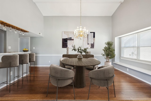 2848 Oxford Ln, Flower Mound, TX 75028 - dining space with dark wood finished floors, a chandelier, and baseboards