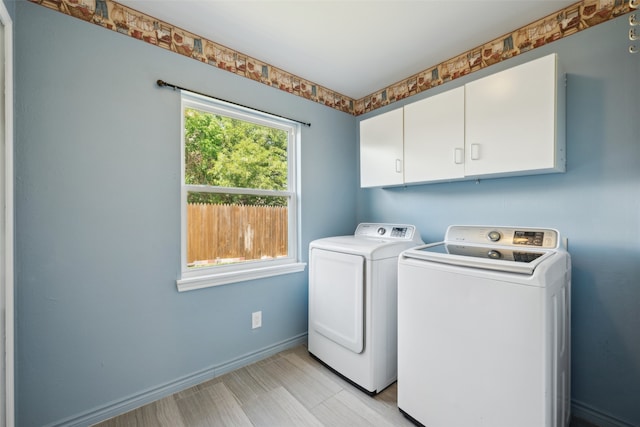 2848 Oxford Ln, Flower Mound, TX 75028 - clothes washing area with cabinet space, separate washer and dryer, and baseboards