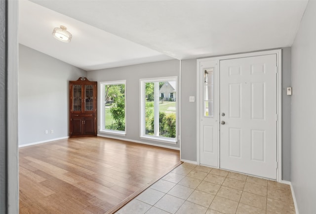 2848 Oxford Ln, Flower Mound, TX 75028 - entrance foyer with baseboards, lofted ceiling, and light tile patterned flooring