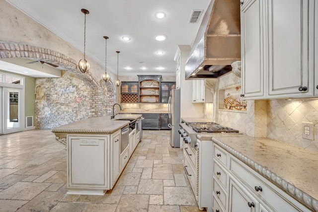 1700 Tall Timber Dr, Tyler, TX 75703 - kitchen featuring exhaust hood, open shelves, stone tile flooring, freestanding refrigerator, and ceiling fan