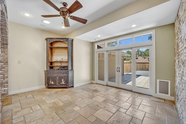 1700 Tall Timber Dr, Tyler, TX 75703 - spare room featuring stone tile floors, french doors, recessed lighting, ceiling fan, and baseboards