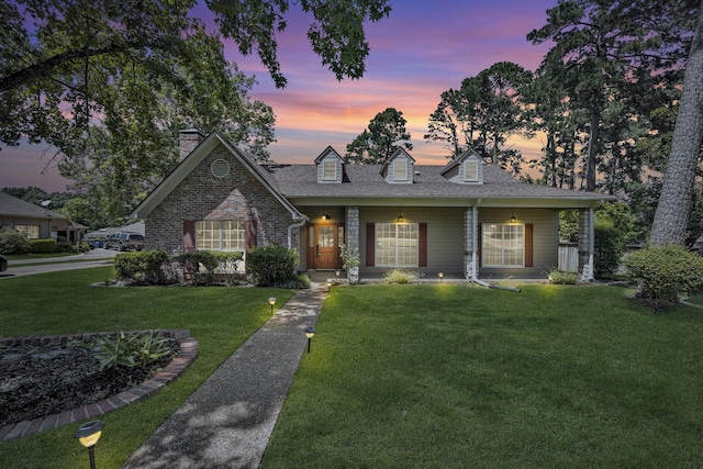 1700 Tall Timber Dr, Tyler, TX 75703 - view of front facade featuring a front yard, a chimney, a shingled roof, and a porch