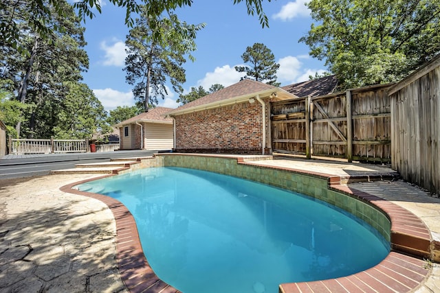 1700 Tall Timber Dr, Tyler, TX 75703 - view of pool with fence, a wooden deck, and a gate
