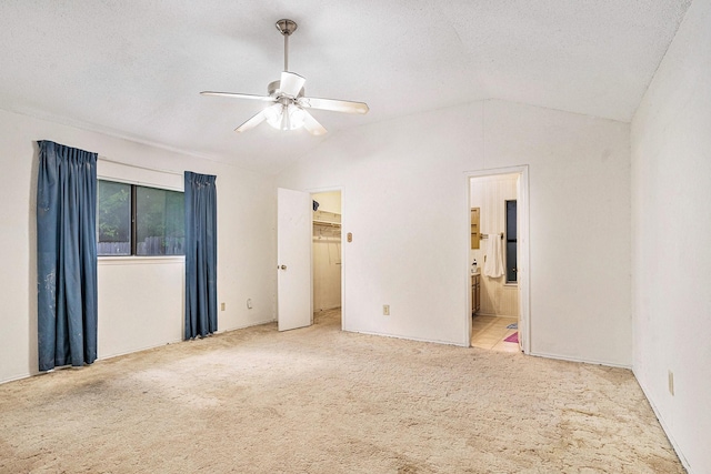 432 Little Fox Ln, Fort Worth, TX 76108 - unfurnished bedroom featuring lofted ceiling, carpet, a spacious closet, ensuite bathroom, and a ceiling fan