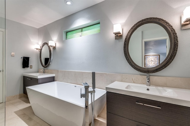 109 Tuscany Ct, Irving, TX 75062 - bathroom featuring two vanities and a soaking tub