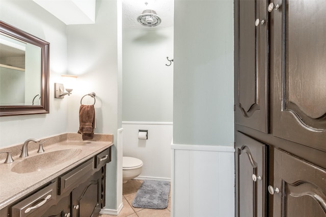 109 Tuscany Ct, Irving, TX 75062 - full bathroom with vanity, wainscoting, and tile patterned floors