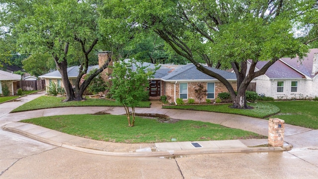 109 Tuscany Ct, Irving, TX 75062 - view of front facade with brick siding and a chimney