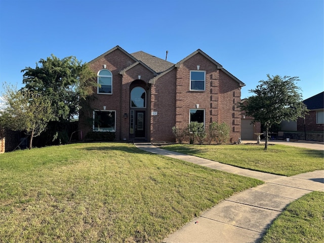traditional home featuring a front lawn and brick siding