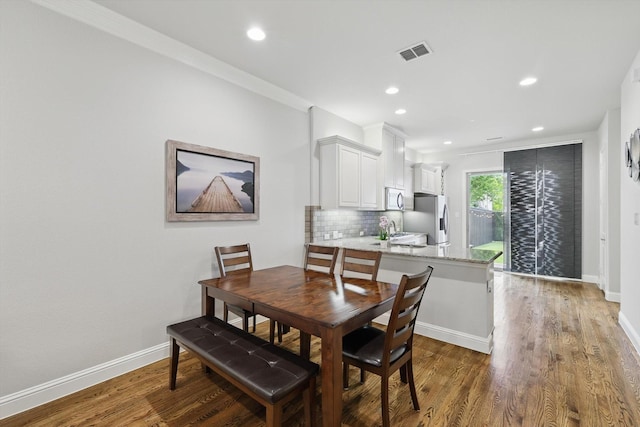 829 Milton Way, Coppell, TX 75019 - dining area with wood finished floors, recessed lighting, and baseboards