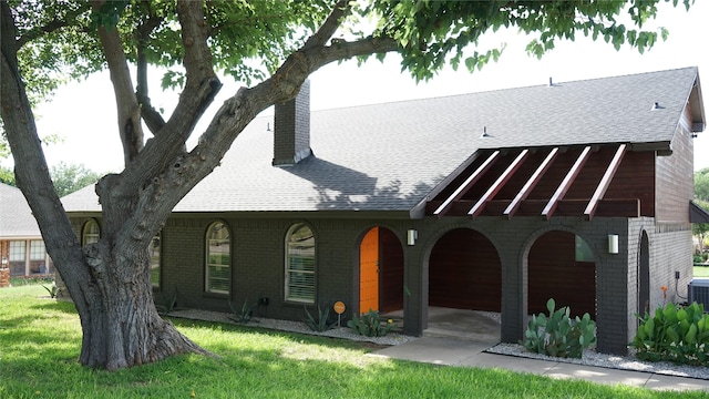 7640 Skylake Dr, Fort Worth, TX 76179 - view of front facade with brick siding, a shingled roof, and a chimney