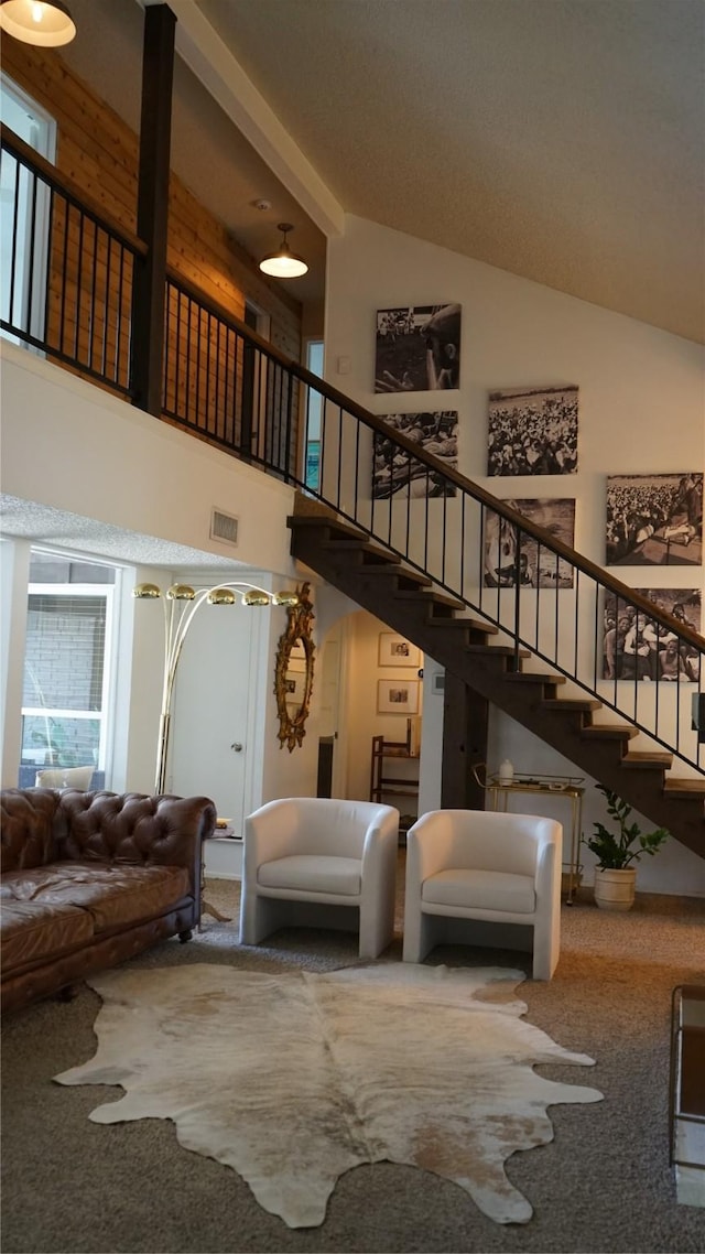 7640 Skylake Dr, Fort Worth, TX 76179 - carpeted living room featuring high vaulted ceiling and stairs