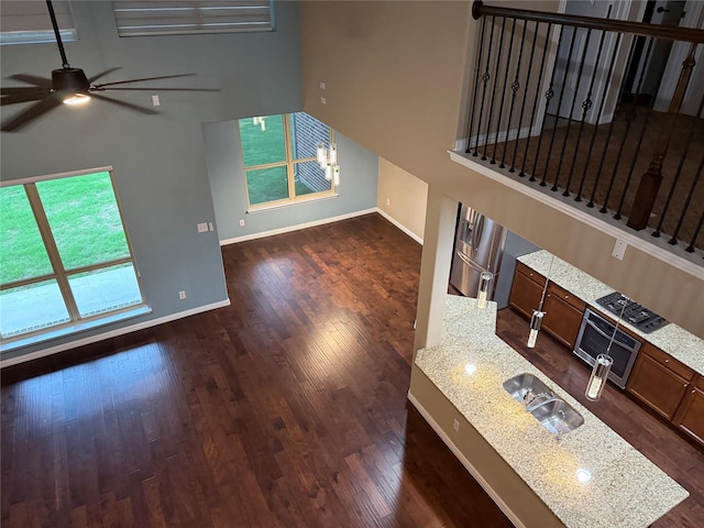 3400 Glen Crest Ln, Denton, TX 76208 - unfurnished living room featuring ceiling fan and dark wood finished floors