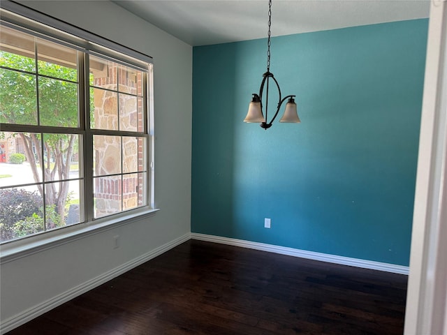 3400 Glen Crest Ln, Denton, TX 76208 - unfurnished dining area featuring dark wood-style flooring and baseboards