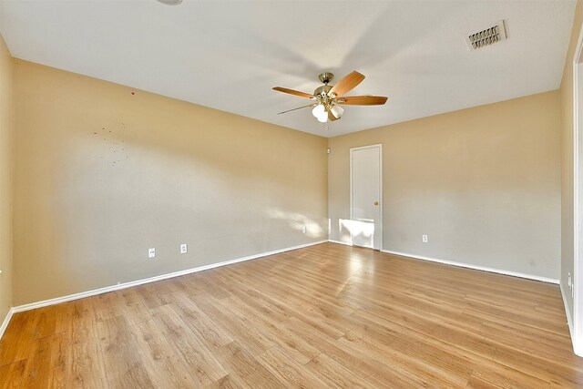 6917 Tessla Dr, Dallas, TX 75241 - spare room featuring a ceiling fan, baseboards, and light wood finished floors