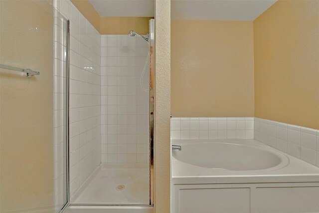 6917 Tessla Dr, Dallas, TX 75241 - bathroom with a shower stall and a bath