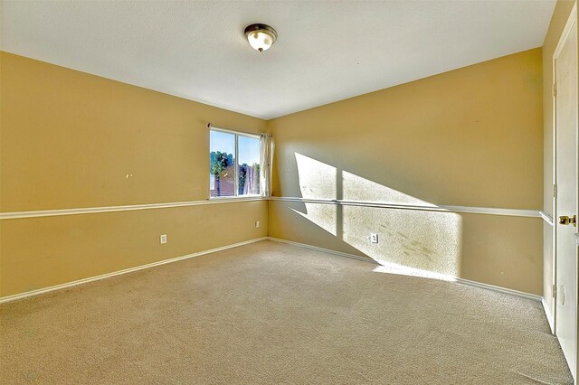 6917 Tessla Dr, Dallas, TX 75241 - carpeted spare room featuring baseboards