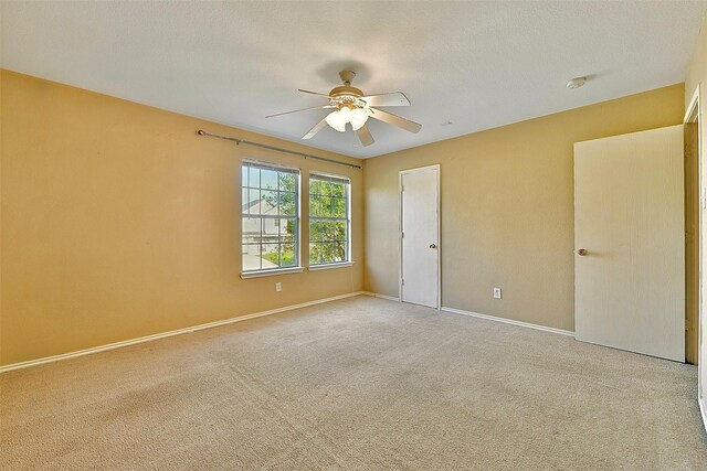 6917 Tessla Dr, Dallas, TX 75241 - unfurnished bedroom featuring carpet, baseboards, and ceiling fan