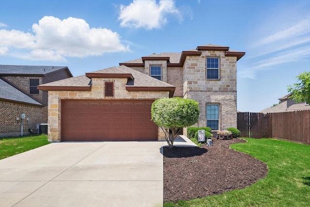 10825 Thorngrove Ct, Fort Worth, TX 76052 - view of front of home featuring stone siding, a garage, driveway, and cooling unit
