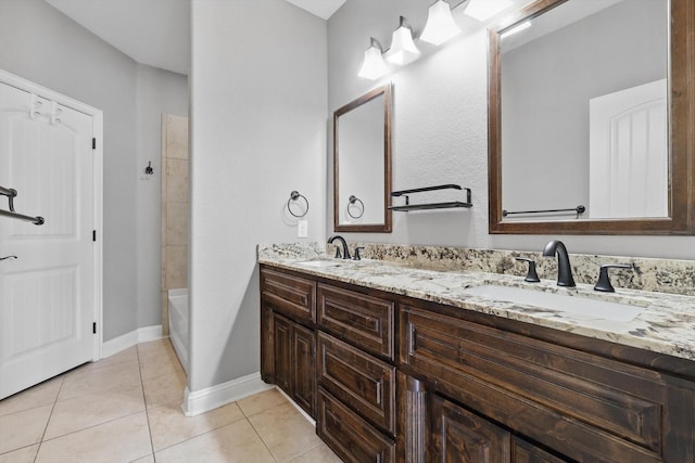 10825 Thorngrove Ct, Fort Worth, TX 76052 - bathroom with double vanity, tile patterned flooring, baseboards, and washtub / shower combination
