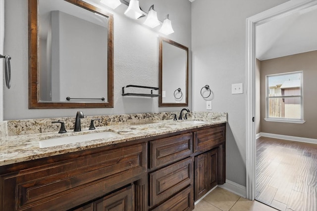 10825 Thorngrove Ct, Fort Worth, TX 76052 - bathroom featuring double vanity, baseboards, and tile patterned flooring