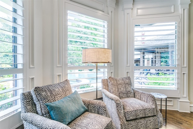 sitting room with wood finished floors and baseboards