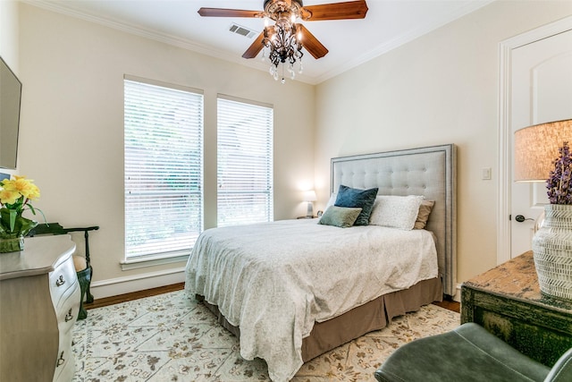bedroom with light wood-type flooring, ornamental molding, baseboards, and a ceiling fan